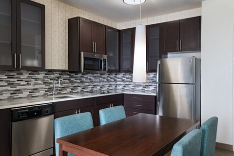 Suite, 1 Bedroom | Private kitchen | Full-size fridge, microwave, stovetop, dishwasher