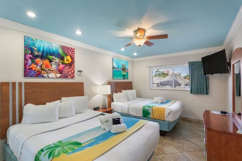 Deluxe One Bedroom Suite: 2 Queen Beds and 1 Sleeper Sofa | Premium bedding, in-room safe, individually decorated