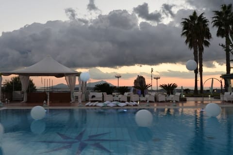 Seasonal outdoor pool, open 9:00 AM to 9:00 PM, sun loungers