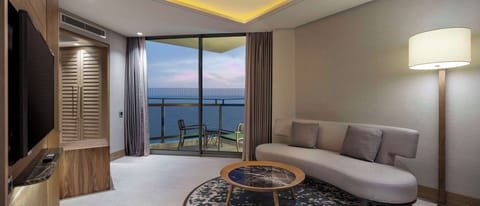 Suite, 1 King Bed, Sea View | Living area