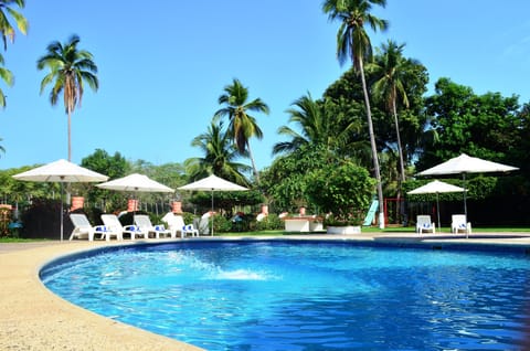 Outdoor pool, open 8:00 AM to 8:00 PM, pool umbrellas, sun loungers