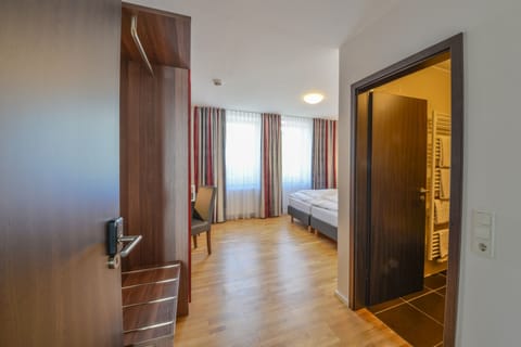 Double or Twin Room | Living area | 85-cm flat-screen TV with satellite channels, TV