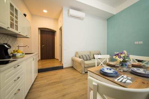 Family Quadruple Room, 1 Bedroom, City View | Living area | 40-inch flat-screen TV with digital channels, TV