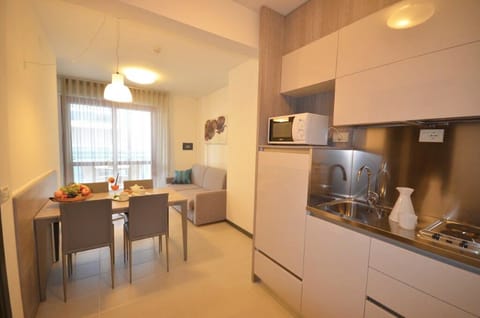 Apartment, Balcony | Private kitchen | Mini-fridge, microwave, stovetop, highchair