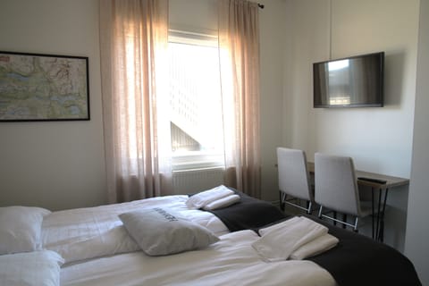 Twin Room, Private Bathroom (Hotel) | Individually furnished, blackout drapes, free WiFi, bed sheets