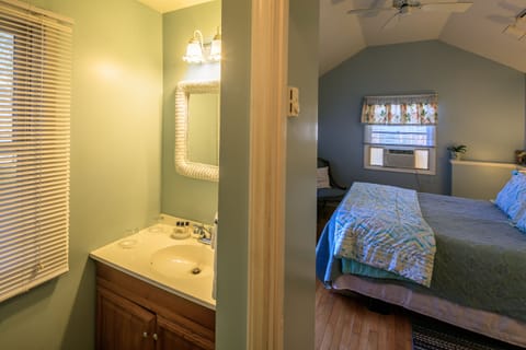 Flower Cottage | Bathroom amenities | Combined shower/tub, deep soaking tub, hair dryer, towels