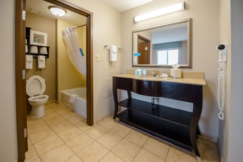 One king studio suite non smoking | Bathroom | Bathtub, hair dryer, towels