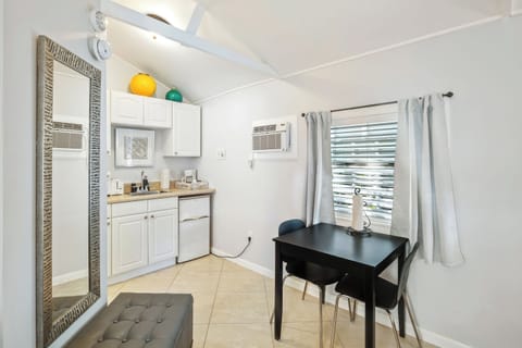 King Suite Pool View | Private kitchen | Fridge, coffee/tea maker, paper towels