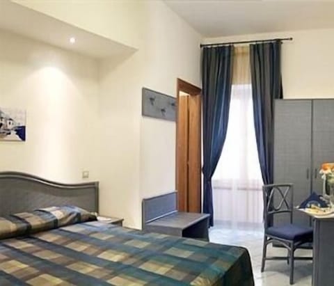 Standard Double Room | Minibar, in-room safe, desk, iron/ironing board