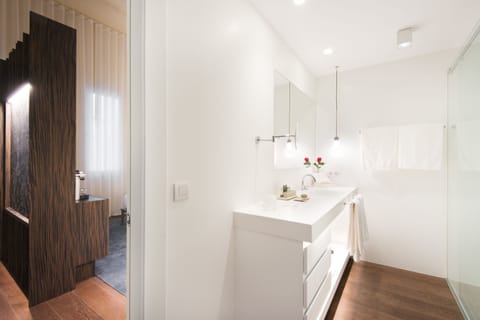 Deluxe | Bathroom | Designer toiletries, hair dryer, bathrobes, slippers