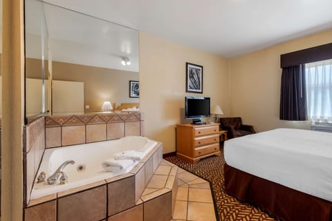 Suite, 1 King Bed, Non Smoking, Jetted Tub | Desk, iron/ironing board, free cribs/infant beds, rollaway beds