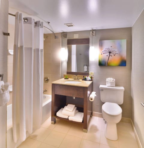 Suite, 1 King Bed, Corner | Bathroom | Combined shower/tub, designer toiletries, hair dryer, towels