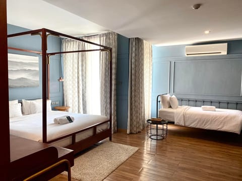 Family Triple Room | Free minibar, in-room safe, desk, blackout drapes