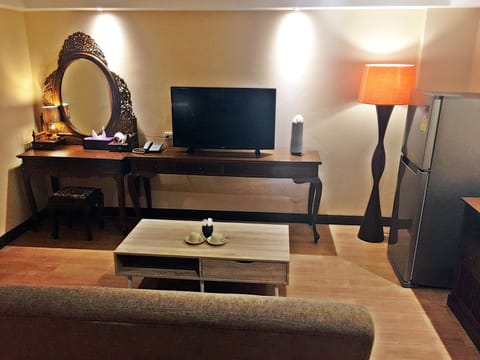 Suite with Two Double Beds | Living room | Flat-screen TV