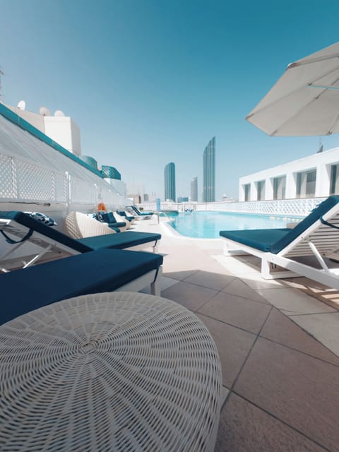 Outdoor pool, pool umbrellas, sun loungers