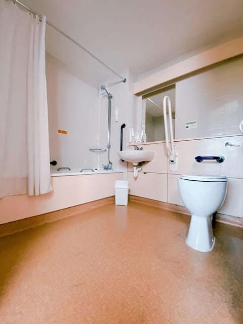 Accessible Twin | Bathroom | Shower, hair dryer, towels