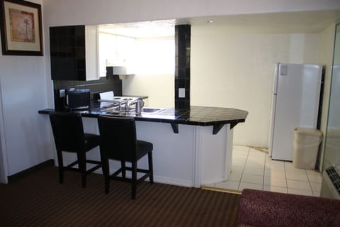 Suite, 1 King Bed with Sofa bed, Non Smoking, Kitchenette | In-room safe, desk, blackout drapes, iron/ironing board