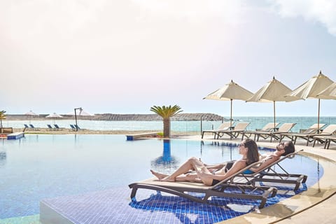 Indoor pool, open 8:00 AM to 8:00 PM, pool umbrellas, sun loungers