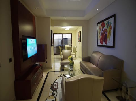 Presidential Penthouse | Living area | 42-inch flat-screen TV with cable channels, TV