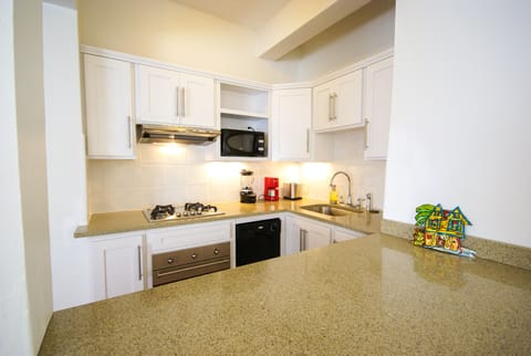 Suite, 1 Bedroom, Garden View | Private kitchen | Fridge, microwave, stovetop, coffee/tea maker