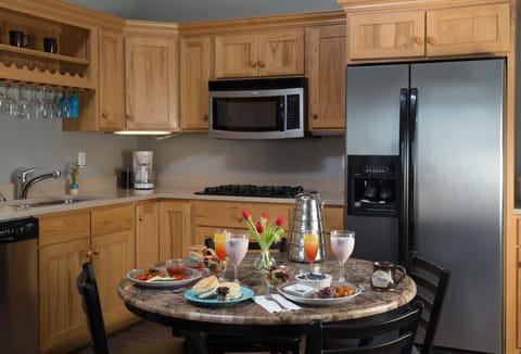 Patio-Level Cottage Suite | Private kitchen | Fridge, microwave, coffee/tea maker, cleaning supplies