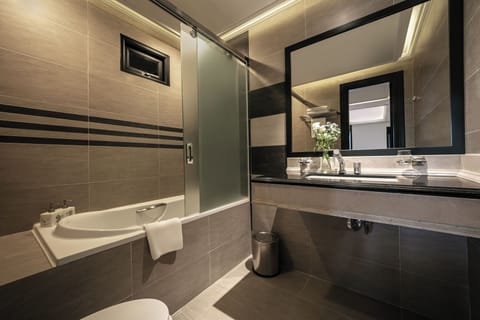 Deluxe Twin With Bathtub - No Window | Bathroom | Rainfall showerhead, designer toiletries, hair dryer, bathrobes