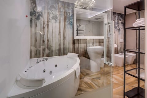 Suite, 1 King Bed, Non Smoking | Bathroom | Free toiletries, hair dryer, bidet, towels