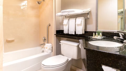 Suite, 1 King Bed | Bathroom | Free toiletries, hair dryer, towels