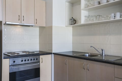 1 Bedroom Apartment | Private kitchen | Fridge, microwave, oven, stovetop