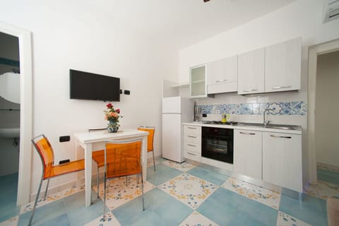 Apartment, 1 Bedroom (Mimì) | Private kitchen | Fridge, stovetop, cookware/dishes/utensils