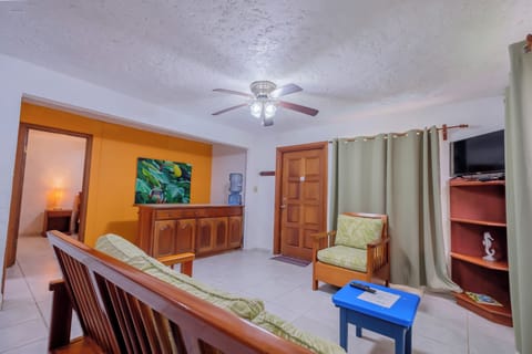 Luxury Condo, 1 Bedroom, Pool View, Garden Area | Living area | 32-inch Smart TV with cable channels, books