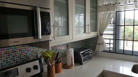 Luxury Apartment, 2 Bedrooms, Kitchen, Garden View | Private kitchen | Full-size fridge, microwave, oven, stovetop