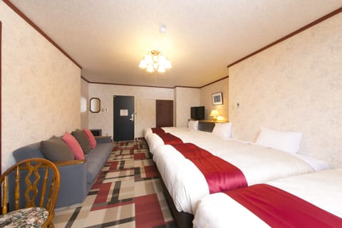 Superior Quadruple Room | Desk, blackout drapes, free WiFi, bed sheets