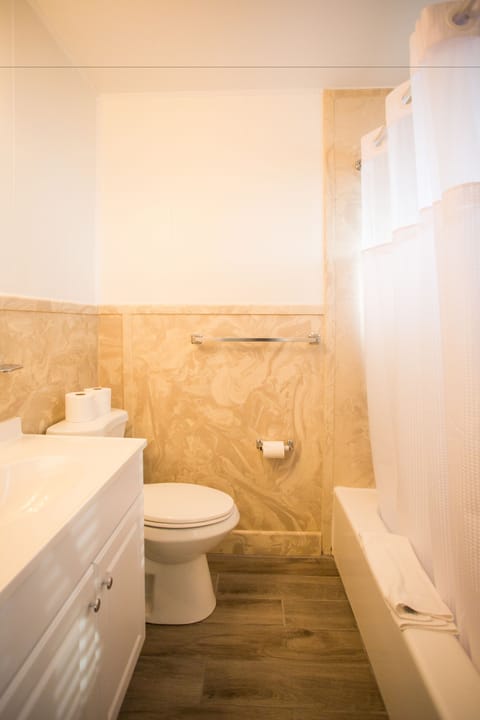 Room, 2 Double Beds | Bathroom | Combined shower/tub, deep soaking tub, free toiletries, hair dryer