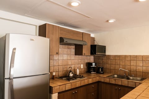 Family Suite, 3 Bedrooms | Private kitchen | Fridge, microwave, stovetop, coffee/tea maker