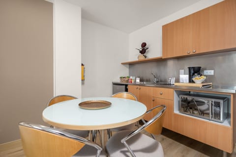 Suite, 2 Double Beds | Private kitchenette | Fridge, dining tables