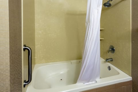 Suite, 1 King Bed (Additional Living Area) | Bathroom | Combined shower/tub, hair dryer, towels, soap