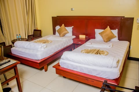 Standard Twin Room, City View | Minibar, in-room safe, desk, free WiFi