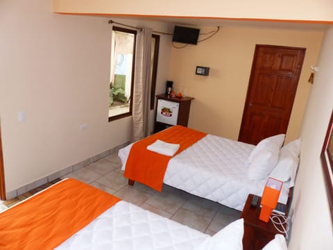 Deluxe Quadruple Room, 1 Bedroom | Bathroom | Shower, free toiletries, hair dryer, towels