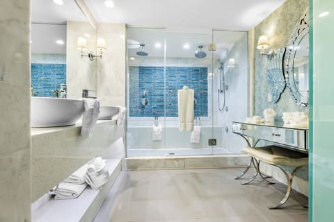 Suite, 1 King Bed (Living Area, Powder Room) | Bathroom | Hair dryer, bathrobes, slippers, towels