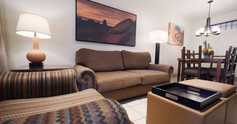 Standard Suite, 2 Bedrooms | Living room | 27-inch TV with cable channels, DVD player