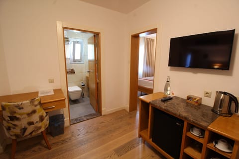 Deluxe Quadruple Room, 1 Bedroom | Free minibar, in-room safe, desk, laptop workspace