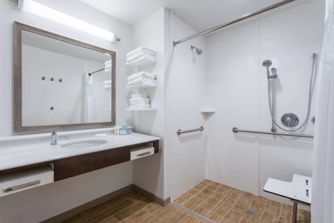 Studio, 1 King Bed, Accessible, Non Smoking (mob/hearing acc w/ roll-in shower) | Bathroom | Free toiletries, hair dryer, towels, soap