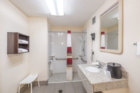 Combined shower/tub, free toiletries, hair dryer, slippers