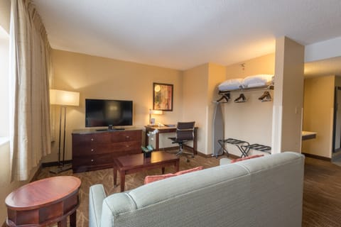 Suite, 2 Queen Beds, Kitchen | Living area | Flat-screen TV, pay movies