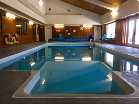 Indoor pool, open 8 AM to 8 PM, pool umbrellas, sun loungers