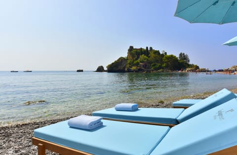 Private beach, black sand, sun loungers, beach umbrellas