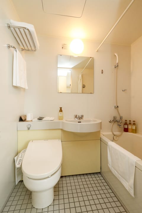 Combined shower/tub, free toiletries, hair dryer, slippers