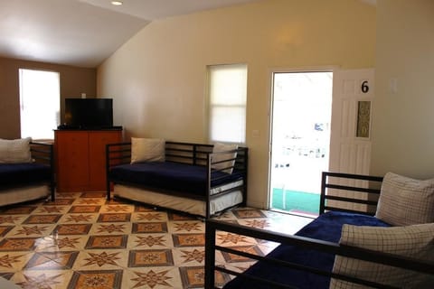 Comfort Apartment, Kitchen, Beachside | Living area | Flat-screen TV