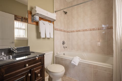 Suite, 1 King Bed | Bathroom | Combined shower/tub, free toiletries, hair dryer, towels